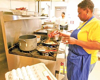 Sandra Robinson cooks all the food by hand putting her own personal touch to every item --Inside the Newport Branch of the Younstown Public Library is a corner cafe that one would see in New York. New Seasonings at Chapters is operated by Everlife Worship Center from the Eastside of Youngstown and offers everything from coffee to salads soups and sandwiches.