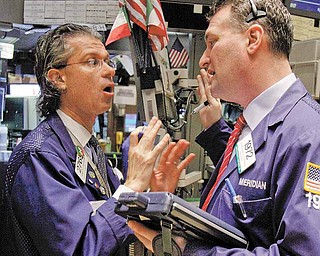 ** ADVANCE FOR USE 12:01 A.M. EST MONDAY MARCH 7 ** FILE - In this Feb. 25, 2011 file photo, specialist Donald Civitanova, left, talks with trader Jonathan Corpina as they work on the floor of the New York Stock Exchange. This week is the second anniversary of the bull market that followed the financial meltdown. The Standard & Poor’s 500-stock index is in its fastest climb since the Great Depression, doubling since the market bottomed on March 9, 2009. (AP Photo/Richard Drew,file)