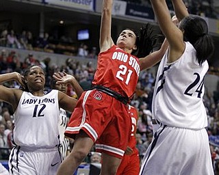 Ohio State guard Samantha Prahalis, center, shoots between Penn State's Zhaque Gray, left, and Mia Nickson in the second half of an NCAA college basketball game for the championship in the Big Ten tournament in Indianapolis, Sunday, March 6, 2011. Ohio State defeated Penn State 84-70. (AP Photo/Michael Conroy)