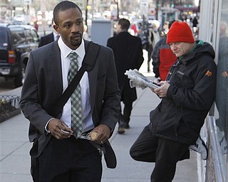 Baltimore Ravens cornerback Domonique Foxworth , left, arrives for football labor negotiations, Friday, March 4, 2011, in Washington. (AP Photo/Alex Brandon)