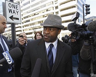 NFLPA Executive Director DeMaurice Smith, center, accompanied by NFLPA spokesman with George Atallah, left, leave after football labor negotiations in Washington Friday, March 4, 2011. (AP Photo/Alex Brandon)