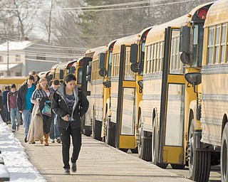 Students at Poland Seminary High School board their school buses after their 3:03 p.m. dismissal from classes.