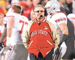 FILE - In this Nov. 20, 2010 file photo, Ohio State football coach Jim Tressel looks on during the second half of an NCAA college football game against Iowa in Iowa City, Iowa. Ohio State athletic director Gene Smith has returned to campus and a news conference has been called for Tuesday night, March 8, 2011, signs that coach Tressel's job might be in jeopardy after a report that he did not tell his superiors that he was aware of potential NCAA violations involving star quarterback Terrelle Pryor and others.