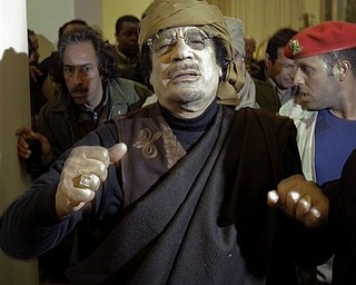 Libyan Leader Moammar Gadhafi arrives at a hotel to give television interviews in Tripoli, Libya Tuesday, March 8, 2011.