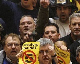 Protesters fill the rotunda at the Ohio Statehouse following Ohio Gov. John Kasich's State of the State address Tuesday, March 8, 2011, in Columbus, Ohio.