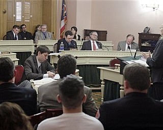 Republican Sen. Shannon Jones, right, testifies before house members on a committee regarding Senate Bill 5 Tuesday, March 8, 2011, in Columbus, Ohio.