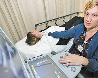 Sharon Gonzalez, Vascular Lab Technician at The Valley Hospital in Ridgewood, New Jersey, conducts a carotid ultrasound on Linda Pollack, Monday, January 24, 2011. Gonzalez used a Sonix Touch Ultrasound system and a grey scale imaging screen with zooming capabilities.