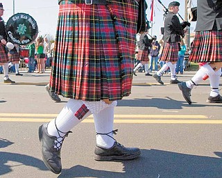 The Red Hackle Pipe and Drum Corp, from Cleveland, Ohio, marches along Market Street during the 2009 Mahoning Valley St. Patrick's Day Parade.