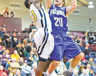 Poland's Jerry Lawman is fouled on the way to the hoop by Streetsboro's Edward Julian Wednesday night at Boardman High School.