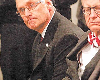 Ohio State football coach Jim Tressel, left, sits next to E. Gordon Gee, Ohio State University president, during a news conference Tuesday, March 8, 2011, in Columbus, Ohio. Ohio State suspended Tressel for two games and fined him $250,000 for violating NCAA rules by failing to notify the school about information he received involving two players and questionable activities involving Buckeye memorabilia. Tressel also will receive a public reprimand and must make a public apology.