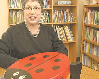 Carole Bopp, Hope House Visitation Center executive director, sits at a lady bug table. Lady bugs are the theme in one of the Center’s visitation rooms and are scattered throughout the facility, which in Fiscal Year 2010 provided services for 136 children, 155 adults and 177 families.