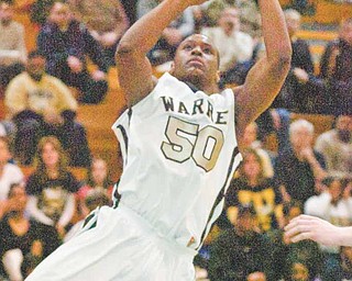 Mik'Quan Dorsey evades the defense of St. Ignatius as he times a jump shot, Thursday, March 10, 2011 at Solon High School.