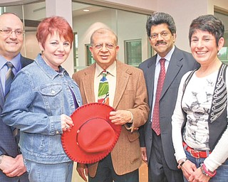 Looking forward to attending the Cattle Baron’s Ball, where they will be honored, are, from left, Dr. Antoine Chahine, Pat Butto, Dr. Sudershan Garg, Dr. Eledath Krishnan and Annette Camacci. Butto and Camacci are cancer survivors, and the doctors are oncologists at the Blood and Cancer Center in Canfield.