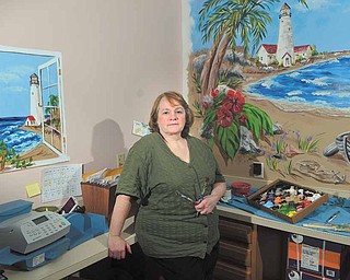 Artist Linda Clark of Hubbard recently completed a beach mural scene in the office at Helping Hands Pediatrics in Sharon, Pa. In the window-less work space, Clark created out-the-window views of the ocean and beach and a large mural of a beach scene. She worked around office equipment to do the paintings.