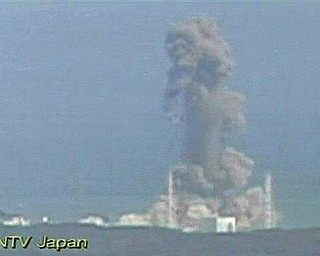 In this image made off Japan's NTV/NNN Japan television footage, smoke ascends from the Fukushima Dai-ichi nuclear plant's Unit 3 in Okumamachi, Fukushima Prefecture, northern Japan, Monday, March 14, 2011. The second hydrogen explosion in three days rocked Japan's stricken nuclear plant Monday, sending a massive column of smoke into the air and wounding 11 workers.