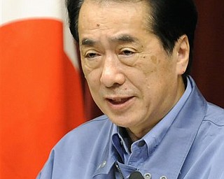 Japan's Prime Minister Naoto Kan addresses the nation through televised press conference in Tokyo Tuesday, March 15, 2011 after a third explosion in four days rocked a crippled nuclear power plant in tsunami-ravaged northeastern Japan early Tuesday.