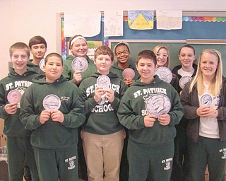 Students in the eighth-grade class at St. Patrick School in Hubbard were the winners of a “Pennies for Pasta” campaign recently at the school. The class raised $412.68 to be donated to the National Leukemia Foundation. A total of $686.78 was raised for the foundation at the school during the fundraiser. Displaying symbolic pennies are the campaign winners, from left, in front, Justin Oaks, Josh Fernandez, Josh DiTimosso, Matt Baytosh and Katie Conlan, and in back, Bobby Dulay, Lexi Pennick, Miriam Denis, Emily Manion and Gabby Hosack.