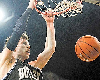 Butler's Matt Howard dunks during the second half of the NCAA college Horizon League conference championship basketball game against Wisconsin-Milwaukee, Tuesday, March 8, 2011, in Milwaukee. Butler won 59-44.