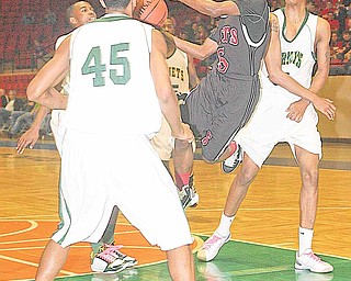 (5) Ja'Meire Brown of Struthers tries to drive into the John Hay defense during their game Thursday night in Canton.