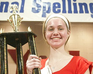 William D. Lewis The Vindicator Lauren Ritz of Willow Creek Learning Center accepts 1 rst place during Vindicator Spelling Bee Saturday.