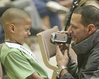 William D. Lewis The Vindicator Bronx Teague, Akiva Academy speller gets videoed by his father Brian Teague before competing in Vindicator Spelling bee Saturay.