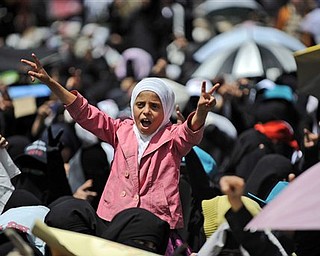 A Yemeni girl reacts during the funeral procession of anti-government protestors killed in Friday's clashes with Yemeni security forces, in Sanaa,Yemen, Sunday, March 20, 2011. The U.S.-backed president of Yemen suffered a devastating political blow on Sunday when his own powerful tribe demanded his resignation, joining religious leaders, young people and the country's traditional opposition in calls for an end to his three decades in power.