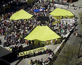 Demonstrators take part in an anti nuclear protest in Madrid, Spain, Sunday, March 20, 2011. The protesters gathered to demand the shutdown of Spanish nuclear power stations and to show support for the Japanese people devastated by Friday's earthquake and tsunami it spawned. Banner at bottom reads "No to nuclear power".