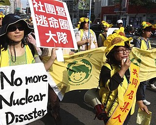 More than 3,000 Taiwanese people demonstrate against the ongoing construction of the fourth nuclear power plant on the island, Sunday, March 20, 2011, in Taipei, Taiwan. The rally came as Taiwanese were alarmed by neighbor Japan's scramble for control over an ongoing nuclear reactor crisis triggered by a 9.0-magnitude earthquake more than a week ago. Despite the crisis, Taiwanese President Ma Ying-jeou has said the construction of the new nuclear power plant will continue. Taiwan is prone to earthquakes like Japan, and a 7.6-magnitude earthquake in central part of the island in 1999 killed more than 2,300 people.