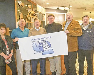 Ed Yasechko, third from left, co-owner of Truck World, receives a Hubbard Township flag as recognition for his business contributions to the community. With him at Truck World in Hubbard Township are, from left, Deborah Shields, executive director of Hubbard Area Chamber of Commerce; Chief of Police Todd Coonce; Fred Hanley, trustee; John Pieton, zoning administrator; and Dennie Parsons, zoning inspector.