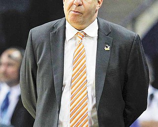 Tennessee head coach Bruce Pearl walks the sideline in the closing seconds of the second half of a West Regional NCAA tournament second round college basketball game against Michigan, Friday, March 18, 2011, in Charlotte, N.C. Michigan won 75-45. 