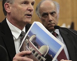 Steve David, director of site services at the Diablo Canyon Power Plant, displays a picture of the nuclear power plant, located near San Luis Obisop, as he discusses the plant's safety in case of an earthquake, during a hearing at the Sacramento,  Calif., Monday March 21, 2011.  A Senate select committee took testimony from various state agencies, natural gas utilities and the operators of California's nuclear power plants on the state's ability to handle an earthquake and possible tsunami like the one the struck Japan last week.   At right is Daniel Hirsch, lecturer in nuclear policy at the University of California, Santa Cruz. 