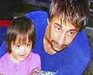 This 2008 Wiens family photo provided by Brigham and Women's Hospital, shows Dallas Wiens with his daughter Scarlette prior to an electrical accident that disfigured his face. Wiens received a full face transplant at Brigham and Women's Hospital in Boston during the week of March 14, 2011.