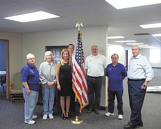 Filling a need: Monsignor Mears Council 3930, Knights of Columbus, from Immaculate Heart of Mary Church in Austintown, recently donated an American flag and flag stand to the Austintown Senior Center, 100 Westchester Drive, Austintown. Involved in the presentation ceremony were, from left, Ivan Croell, K. of C. member; Kay Lavelle, center program director; Lisa L. Oles, Austintown trustee; Bill Adams, center administrator; and Frank Sofranko, Frank Bennet and John Serenko, K. of C. members.