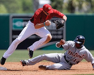 Houston Astros' Tommy Manzella, left, forces out Detroit Tigers' Austin Jackson in the fourth inning of a spring training baseball game Monday, March 21, 2011 in Kissimmee, Fla. 