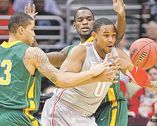 Ohio State's Jared Sullinger (0) loses the ball against George Mason's Isaiah Tate (13) and Mike Morrison, back, in the first half of an East regional NCAA college basketball tournament third-round game Sunday, March 20, 2011, in Cleveland. 