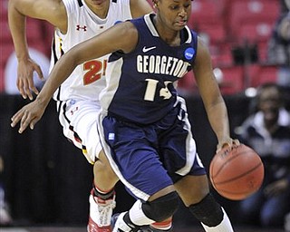 Georgetown's Sugar Rodgers steals the ball from Maryland's Alyssa Thomas during the first half of a second-round game in the NCAA women's college basketball tournament Tuesday, March 22, 2011, in College Park, Md. 