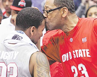 David Lighty Sr., right, kisses his son, Ohio State guard David Lighty, after Ohio State's 98-66 win over George Mason in an East regional NCAA college basketball tournament third-round game Sunday, March 20, 2011, in Cleveland. Lighty scored 25 points and made seven 3-point shots to lead Ohio State into the Sweet 16.