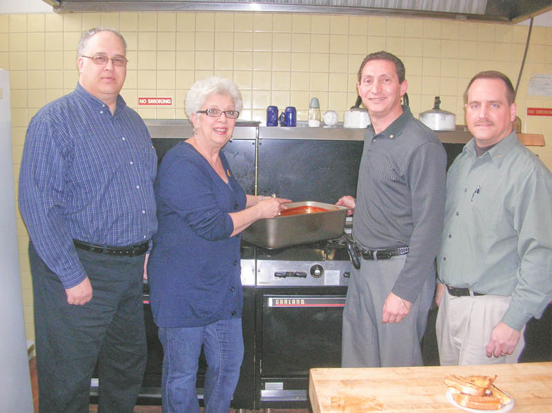 Here’s what’s cookin’: Involved in preparations for an annual spaghetti dinner to be sponsored by Struthers Rotary Club are, from left, Tom Baringer, dinner chairman; Mary Ann Morell, head chef; Don Gabriele, dinner co-chairman; and Bryan Higgins, club president. Assisting them at the event from 3 to 7 p.m. April 2 at St. Nicholas Social Hall, 765 Fifth St., Struthers, will be members of Struthers High School Interact Club and of Boy Scout Troop 101. Meals will be $6 for adults and $3 for children under 12 and proceeds will benefit local community projects.