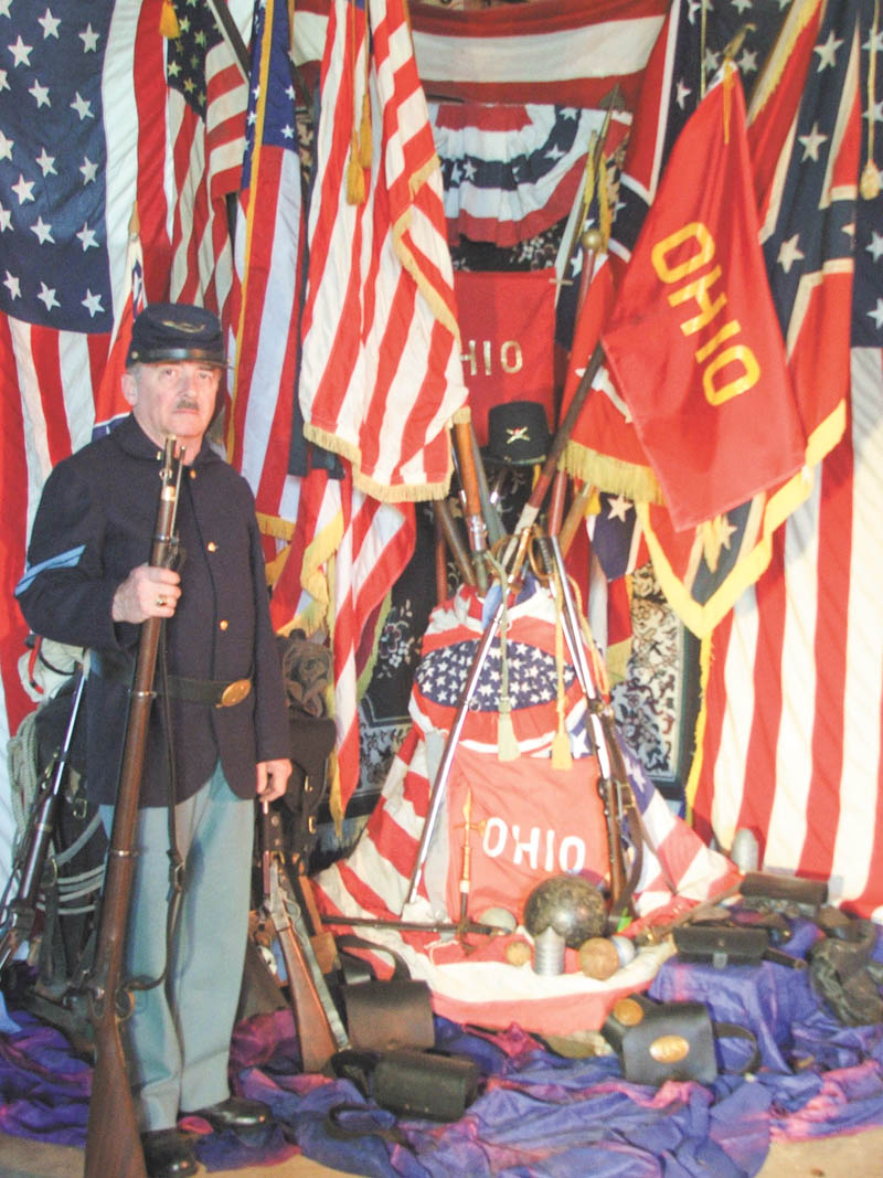 Civil War re-enactor Doug Babyak is a member of the planning committee coordinating quarterly events sponsored by the Sutliffe Museum in Warren that will commemorate the Civil War. The first event in the series will be April 12 at the Eastwood Mall Complex. Here Babyak, of Hartford, displays flags from the war. 