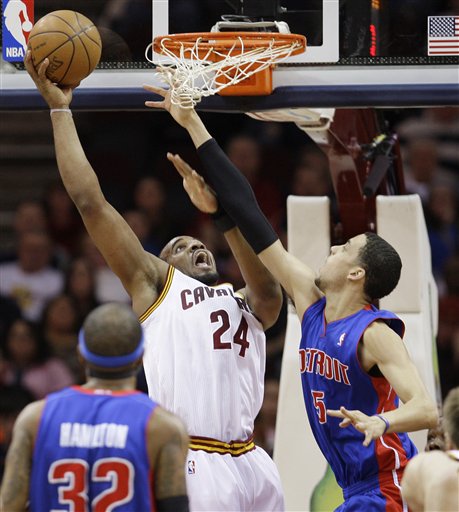 Cleveland Cavaliers' Samardo Samuels (24) shoots over Detroit Pistons' Austin Daye (5) in the first quarter in an NBA basketball game on Friday, March 25, 2011, in Cleveland. 