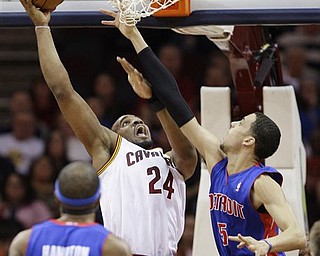Cleveland Cavaliers' Samardo Samuels (24) shoots over Detroit Pistons' Austin Daye (5) in the first quarter in an NBA basketball game on Friday, March 25, 2011, in Cleveland.