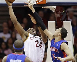 Cleveland Cavaliers' Samardo Samuels (24) shoots over Detroit Pistons' Austin Daye (5) in the first quarter in an NBA basketball game on Friday, March 25, 2011, in Cleveland. 