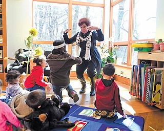 Roz Gadd of Youngstown leads story time at the fifth annual Plant the Seed to Read book festival at Fellows Riverside Gardens on Saturday afternoon.