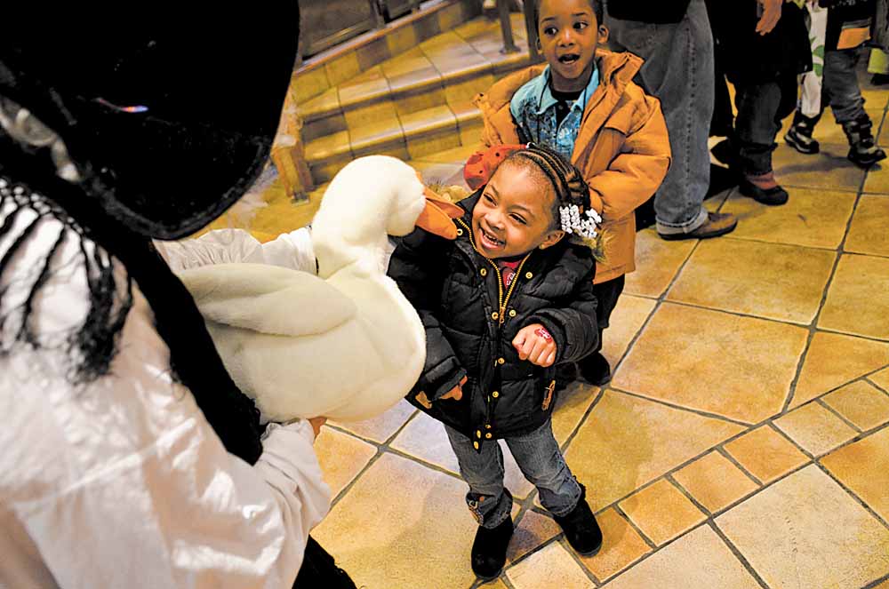 Daelyn McGuiere,3, of Youngstown visits with Mother Goose played by story teller Barbra Root at the Plant the Seed to Read book festival. 
