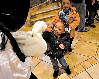 Daelyn McGuiere,3, of Youngstown visits with Mother Goose played by story teller Barbra Root at the Plant the Seed to Read book festival.