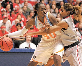 Tennessee guard/forward Shekinna Stricklen (40) is guarded by Ohio State center Jantel Lavender during the second half of an NCAA women's college basketball tournament regional semifinal, Saturday, March 26, 2011 in Dayton, Ohio. Stricklen led Tennessee to an 85-75 win with 20 points.