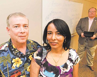 William, left, and Luchia Kingsley, pictured at the office of Patrick Dougherty in Plano, Texas, February 22, 2011, received financial advice from Dougherty during their retirement.