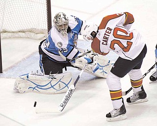 Pittsburgh Penguins goalie Marc-Andre Fleury (29) stops a shot by Florida Panthers' Ryan Carter (20) in the first period of an NHL hockey game on Sunday, March 27, 2011, in Pittsburgh.