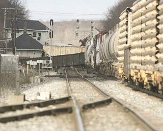 Looking westbound, a few train cars set sideways on the tracks Monday morning after a CSX train derailed near North Center Street in Newton Falls.
