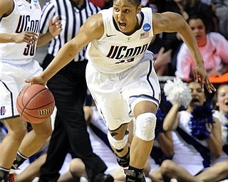 Connecticut forward Maya Moore (23) charges up court with the ball during the second half against Duke in an NCAA women's college basketball tournament regional final game, Tuesday, March 29, 2011, in Philadelphia. Connecticut won the regional championship 75-40. Moore, a four-time All-American with 3,000 career points, scored 28 points.
